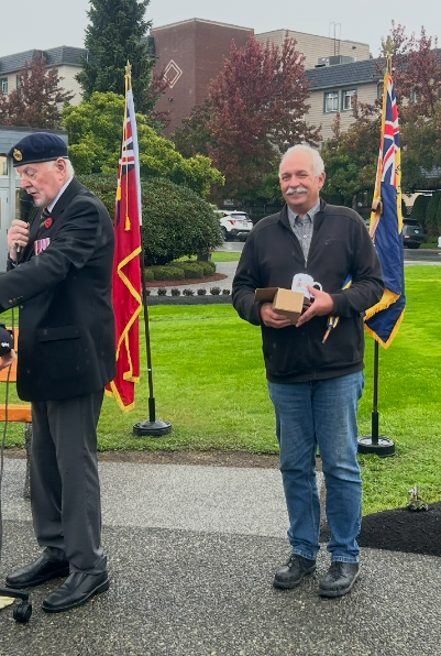 Brian Robinson receiving a gift of appreciation from the Royal Canadian Legion