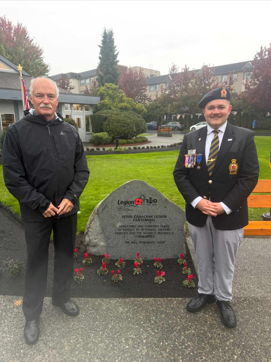 Jack McClintock standing with Ryan Trelford, President of Royal Canadian Legion Branch 37, beside the new memorial